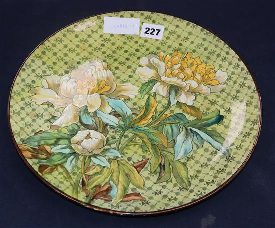 A Doulton lambeth faience dish, by Fanny Stable, c.1880, painted with chrysanthemums diameter 31.5cm